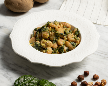 Gnocchi di patate dolci al ragù di spinaci e nocciole
