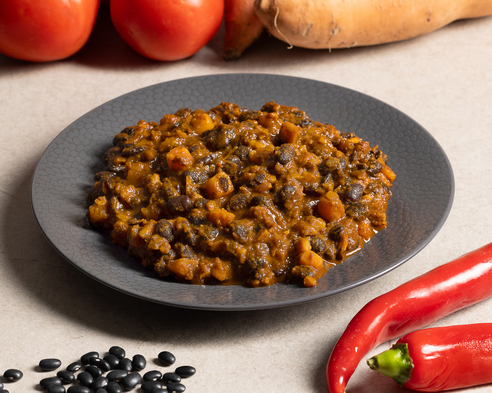 Stufato speziato di fagioli neri e batata rossa